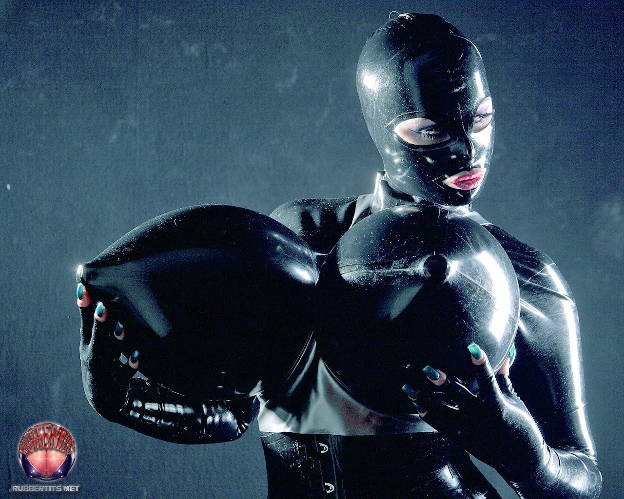 Kinky Fetish Girl In Black Latex And Rubber Hood Plays With Her Megatits 